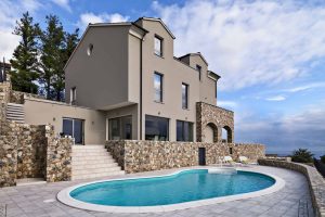 exteriors-view-of-a-modern-villa-in-the-foreground-the-swimming-pool.jpg